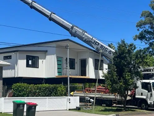 Image of modular home being craned