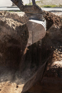 excavator digging on construction site